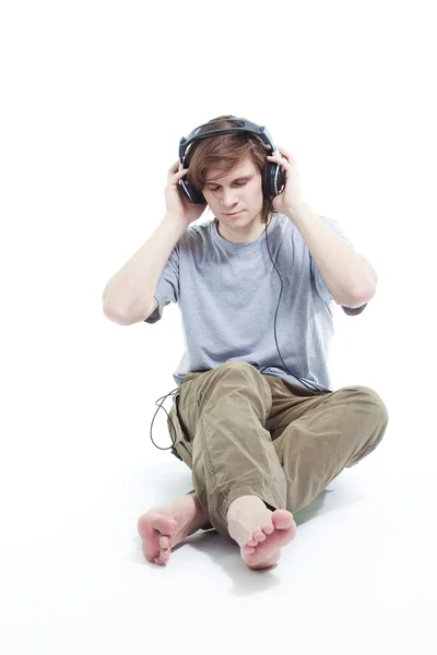 stock image Young man listening music