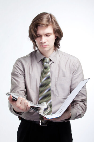 Confident business man portrait with a folder in his arm