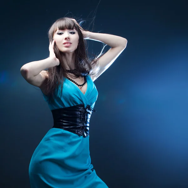 Beautiful girl in a blue dress — Stock Photo, Image