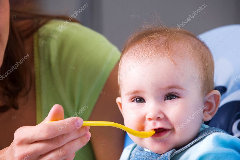 Mother feeding hungry baby — Stock Photo © valuavitaly 4245748