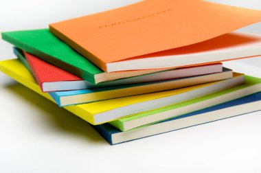 Fan-shaped stack of coloured books clipart