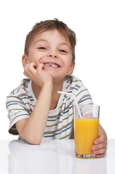 Niño con un vaso de jugo —  Fotos de Stock