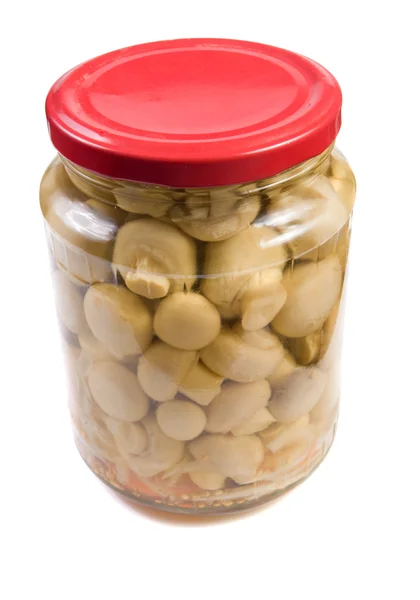 Marinaded mushrooms in a glass jar . — Stock Photo, Image