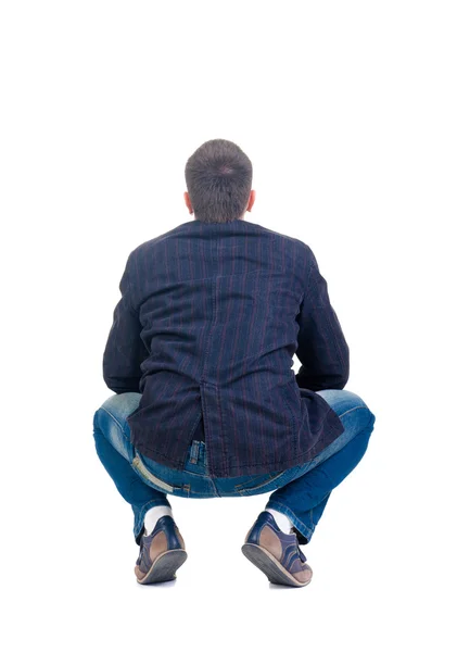 Sitting young man looking afar. Rear view. — Stock Photo, Image