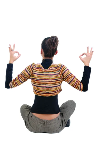 Beautiful businesswoman exercising yoga .rear view — Stock Photo, Image