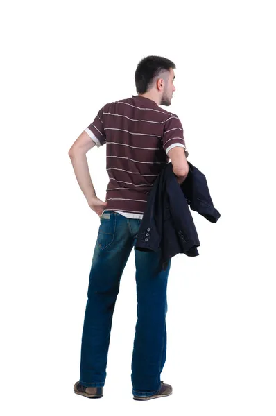 Young man looks ahead. rear view. Stock Photo