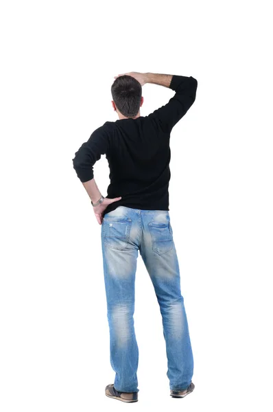 Young man looks ahead. rear view. — Stock Photo, Image