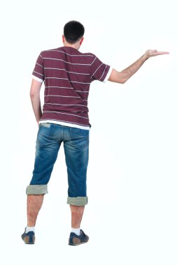 Young man looking at wall. rear view. Isolated over white .