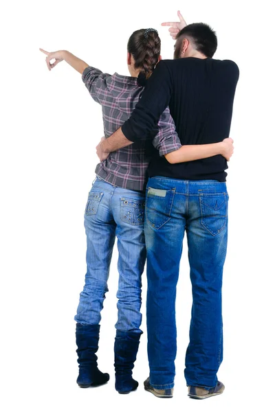 Young couple looks where that. Rear view. — Stock Photo, Image