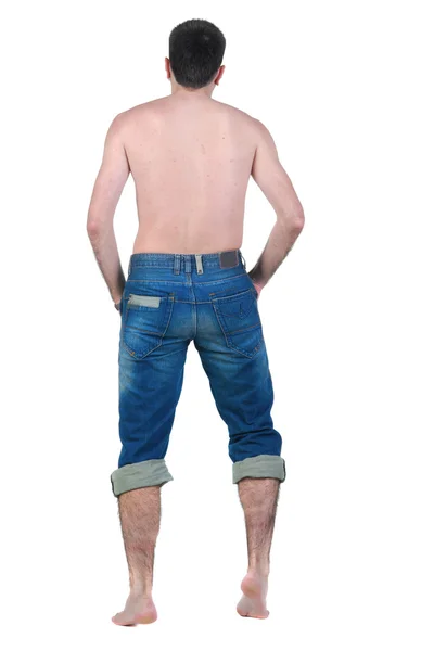 Seminude young man looks ahead. rear view. — Stock Photo, Image