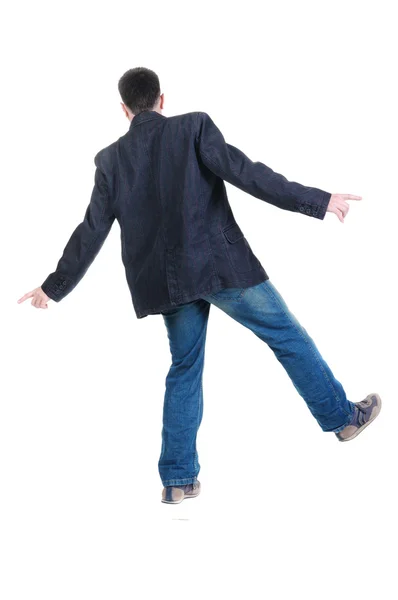 Kiegyensúlyozó fiatal férfi kabát. nézet hátulról. — Stock Fotó