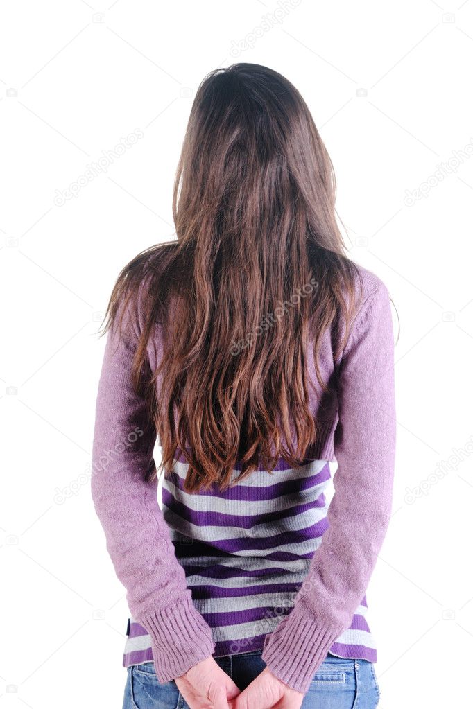 Beautiful young woman looking at wall. Rear view. Isolated over white.