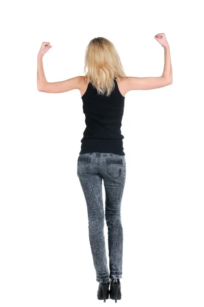 Blonde shows a biceps. Rear view. — Stock Photo, Image