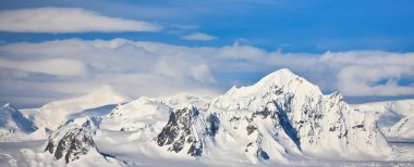 Snow-capped mountains in Antarctica clipart