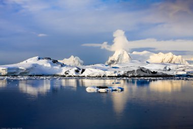 The mountains and their reflection clipart