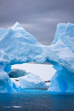 Large Antarctic iceberg with a cavity inside clipart