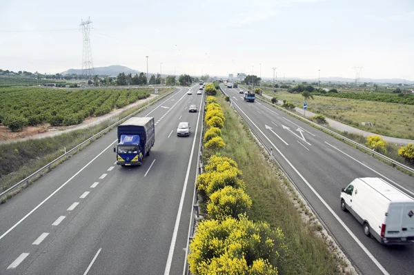 stock image General view of a highway with cars and truck traffic