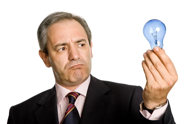 Reife Geschäftsmann Mit Einer Lampe Isoliert Auf Weiß — Stockfoto