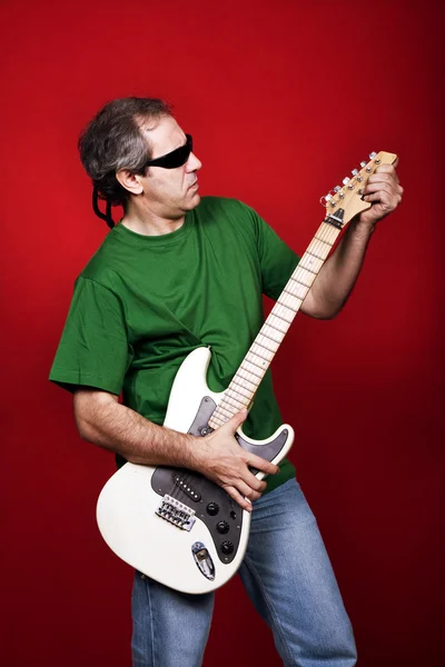 Mature Man Playing Guitar Red Background — Stock Photo, Image