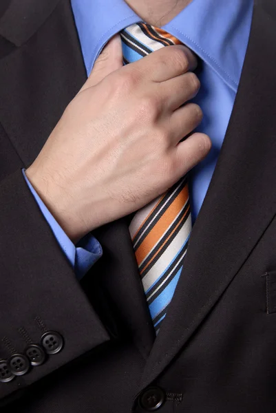 一个戴着彩色领带的商人的详细情况 — 图库照片