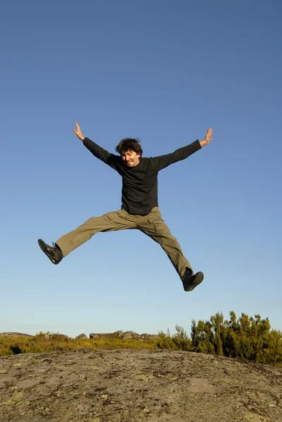 Young Man Jumps High Mountain — Stock Photo, Image