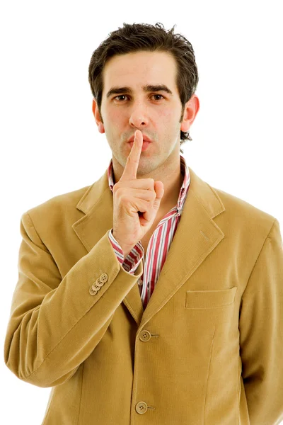 若い男が口の中で彼の指で沈黙のジェスチャーを示す — ストック写真