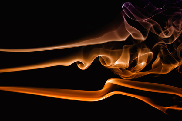 Abstract colored smoke in a black background