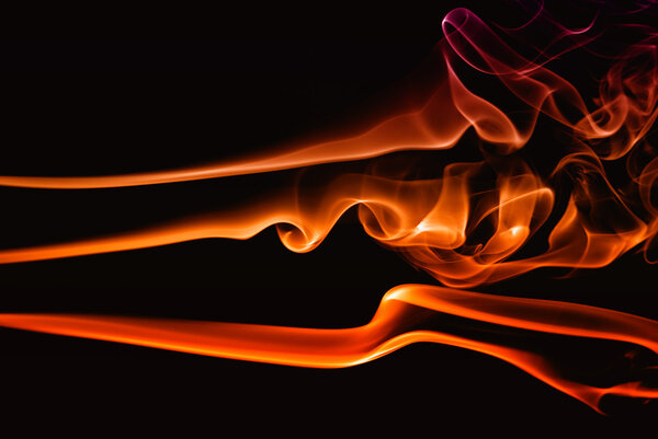 Abstract colored smoke on a black background