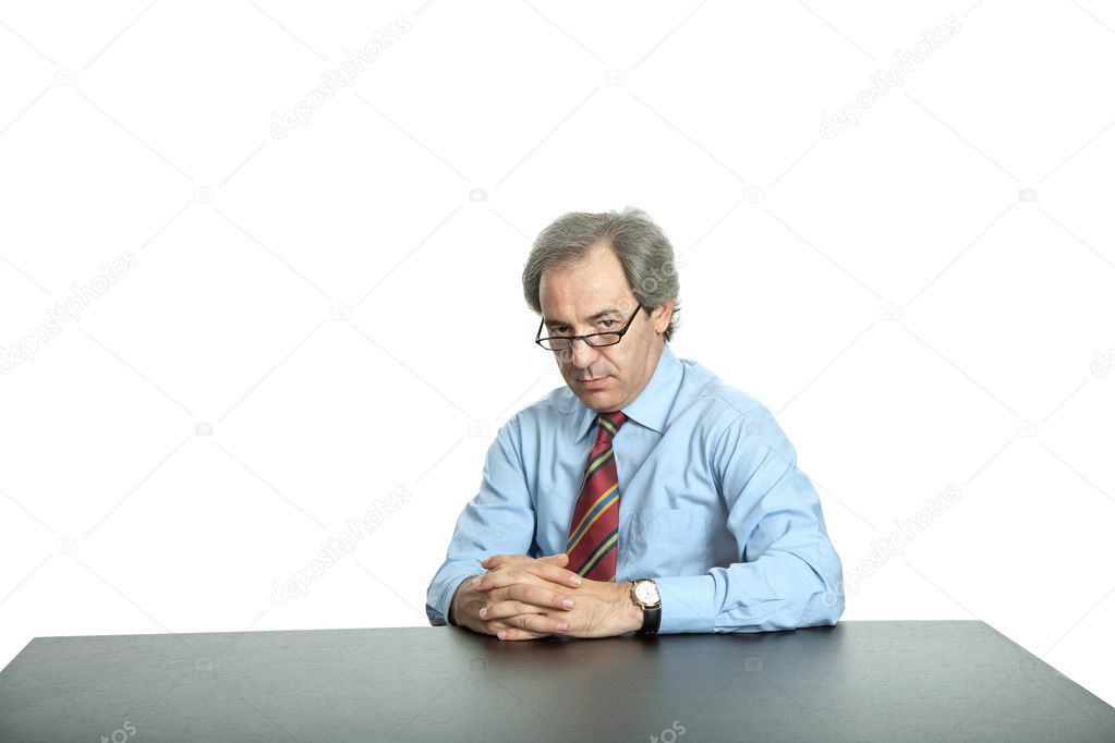 Mature business man on a desk, isolated on white