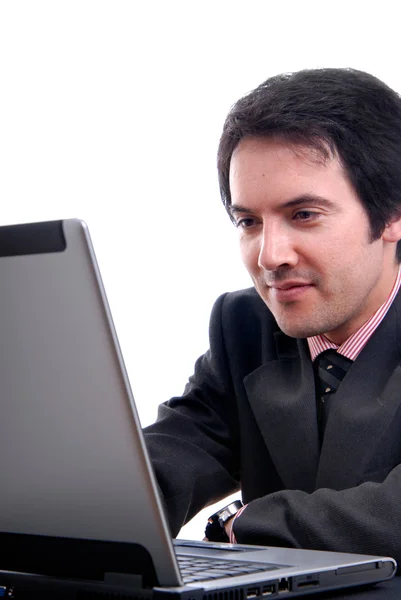 英俊的年轻商业男人工作用的笔记本电脑 — 图库照片