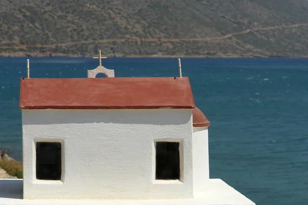 stock image small white chapel at the coast in the island of crete, greece