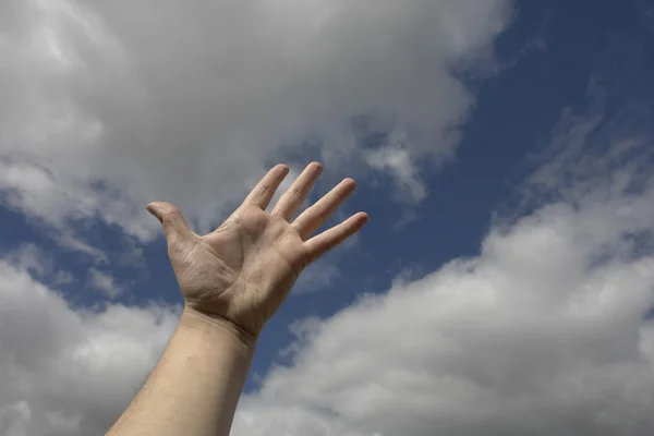 stock image Arm in the clouds