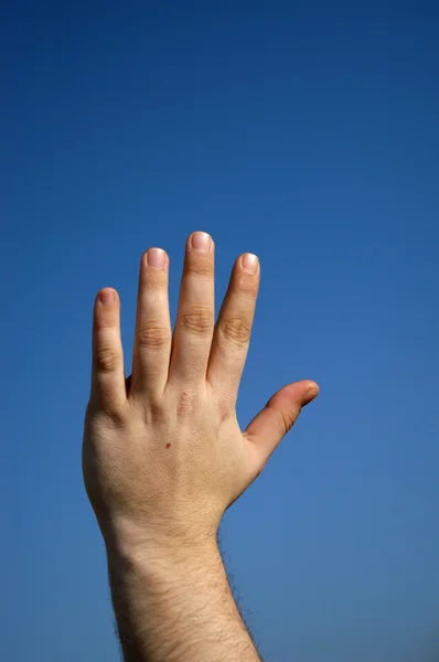 Рука небо — стоковое фото