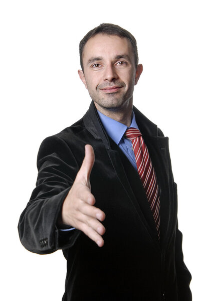 Young man in suit offering to shake the hand
