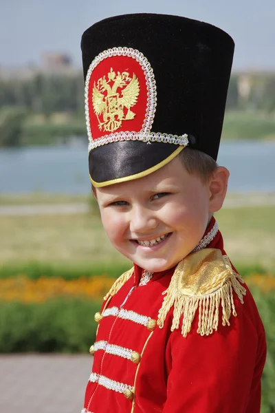 Little boy on nature in the suit of hussar — Stock Photo, Image