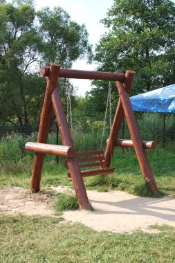 Swings in a park clipart