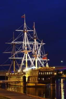 Frigate on the river at night, the city of Veliky Novgorod clipart