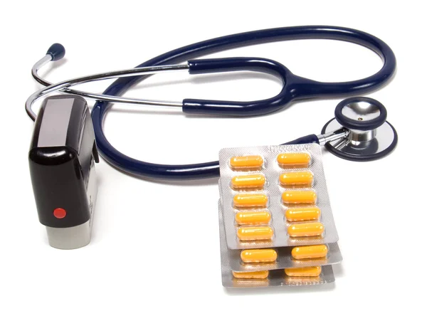 Estetoscópio, comprimidos e selo médico — Fotografia de Stock