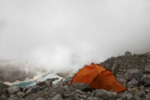 Orange tent in a mist — Stock Photo, Image
