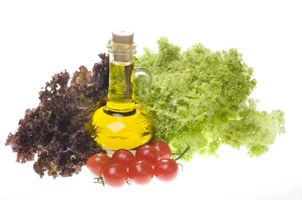Food close-up with olive oil and vegetables — Stock Photo, Image