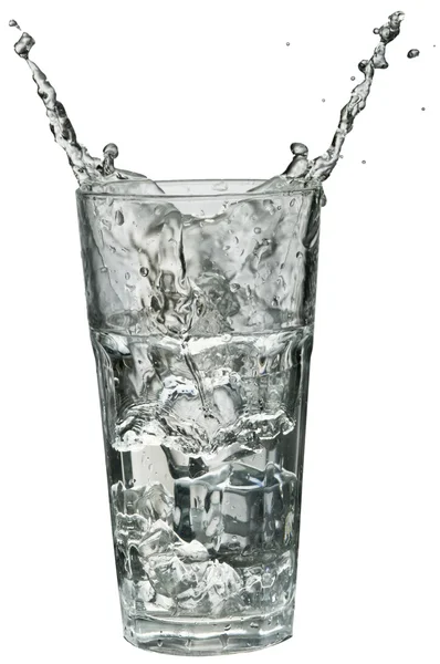 Water spatten uit een glas — Stockfoto