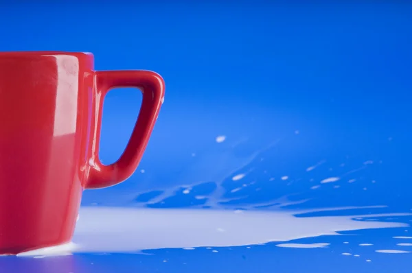 Part of red big cup with milk — Stock Photo, Image