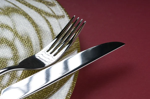 stock image Fork and knife on a plate