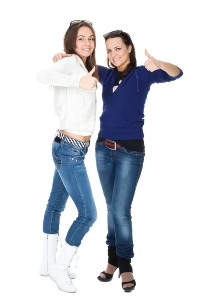 Two girls friends in jeans isolated on white — Stock Photo, Image