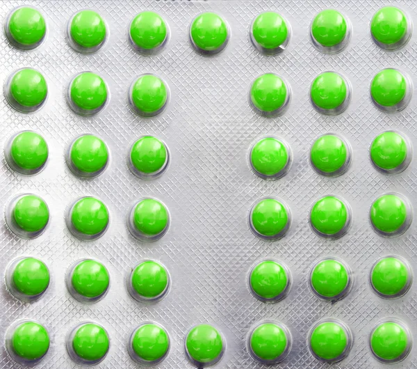 A fém buborékcsomagolást sárga tablettát — Stock Fotó
