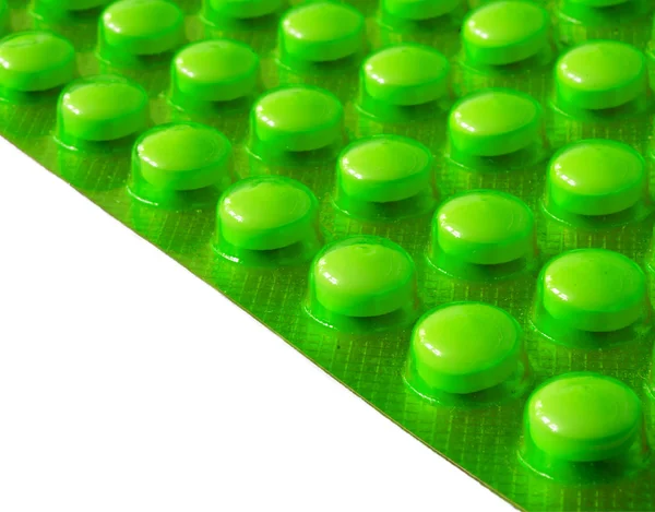 Egy elszigetelt fehér tabletta buborékfóliában — Stock Fotó