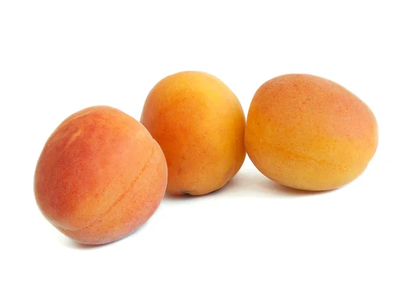 Three apricots on white background — Stock Photo, Image