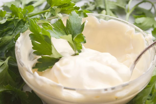 stock image Cream sauce in a glass container, decorated with parsley