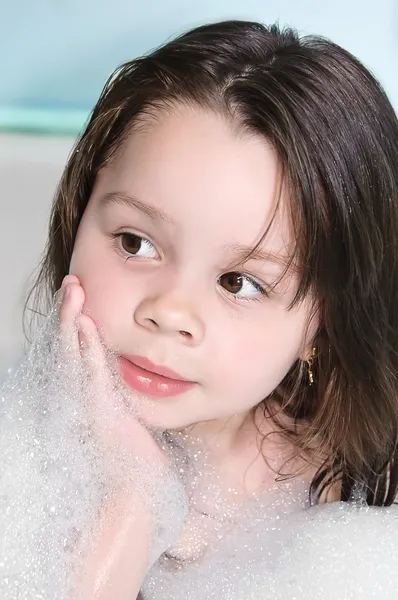 Little girl in the foam — Stock Photo, Image