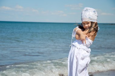 Child on coast of sea